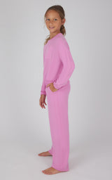 Girls long-sleeve pullover and pants set in soft fuchsia pink terry fabric.