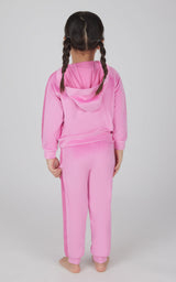Toddler girl wearing super pink velour hoodie jacket and matching jogger pants set from back.