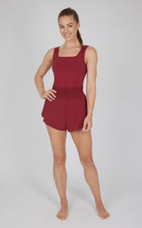 Women's sleeveless red short romper with square neckline and elastic waist tie.