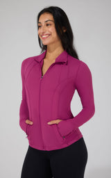 Women's full zip runner jacket in vibrant plum violet with thumbholes and side pockets.