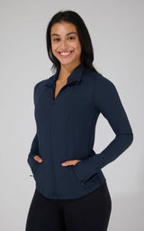 Dark navy full zip runner jacket with side pockets and fitted design on model.