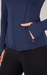 Dark navy full zip runner jacket with zippered pocket and thumb holes on sleeves.