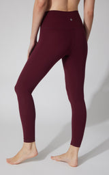 Women's ankle-length leggings in deep Windsor Wine with a smooth, high-rise waistband and seamless design.