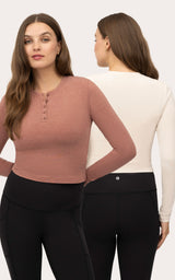Two women's long sleeve crewneck tops, one in heather mahogany with buttons, the other in heather cream, both paired with.