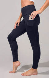 Black high waist fleece-lined leggings with a side pocket holding a smartphone.