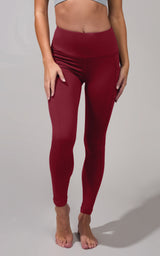 High waist fleece-lined leggings in deep red with side pockets.