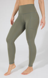 High waist fleece-lined leggings in olive green with side pockets and a smooth, fitted design.