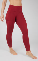 High waist fleece-lined leggings in deep red with side pockets and smooth waistband.