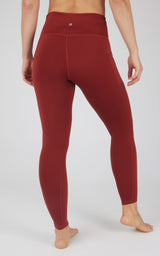 High waist fleece-lined leggings in deep red with flat seams and contoured back pockets.