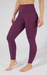 Women's plum violet high-rise Power Flex leggings with smooth, stretchy fabric and no pockets.
