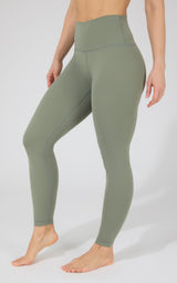 Women's high-waisted olive green Power Flex leggings with smooth, stretchy fabric and no pockets.