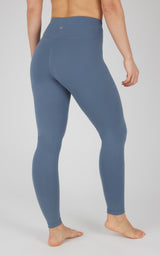 Women's high-waist blue Power Flex leggings with smooth, stretchy fabric and no pockets.