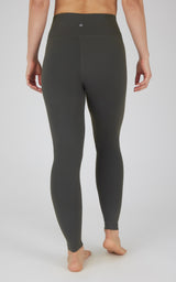 Dark green high-waist seamless leggings with flat waistband and smooth finish.