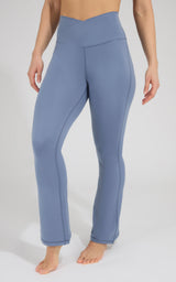 Symphony blue flare leg pants with crossover elastic-free waist, smooth stretch fabric.