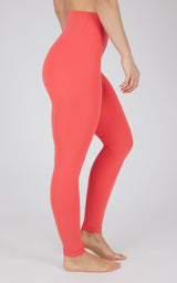 High-waisted full-length leggings in vibrant cayenne red with smooth, seamless fit.