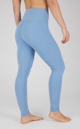 Full-length high-waisted light blue leggings with smooth, seamless design and contoured fit.