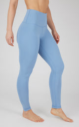 Light blue full-length high-waisted Nude Tech leggings with smooth, fitted fabric.