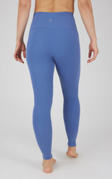 Full-length women's leggings in muted cornflower blue with high waistband and smooth finish.