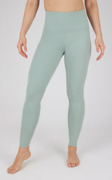High-waist full length seamless leggings in muted green with smooth matte finish.