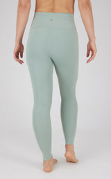 Full-length muted green high-waisted women's leggings with smooth, seamless finish and slim fit.