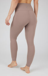 Full-length nude brown high-waisted leggings with smooth, stretchy fabric and contouring seams.