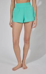 Women's Mountain Sage Lightstreme Love and Flutter running shorts with elastic waistband.