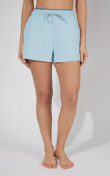 Light blue stretch woven running shorts with elastic waistband and front drawstring.