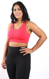 Plus seamless racerback bra in vibrant calypso red on plus-size woman.