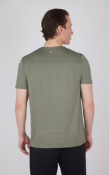 Men's short sleeve track t-shirt in mulled basil green with crew neck and regular fit shown from back.