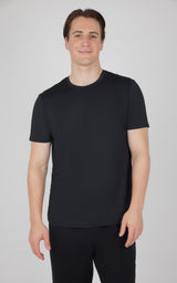 Men's black short sleeve crew neck t-shirt with regular fit on model.