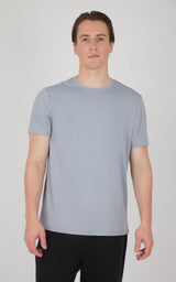 Men's light gray short sleeve crew neck T-shirt with regular fit on model.