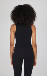 Black cotton mock neck tank top with sleeveless design, fitted style on model.