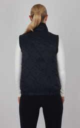 Black quilted vest with diamond pattern, high collar, and sleeveless design on a model.