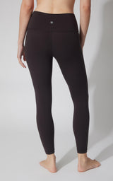 Women's black high-waisted ankle leggings with seamless design and back waist logo detail.