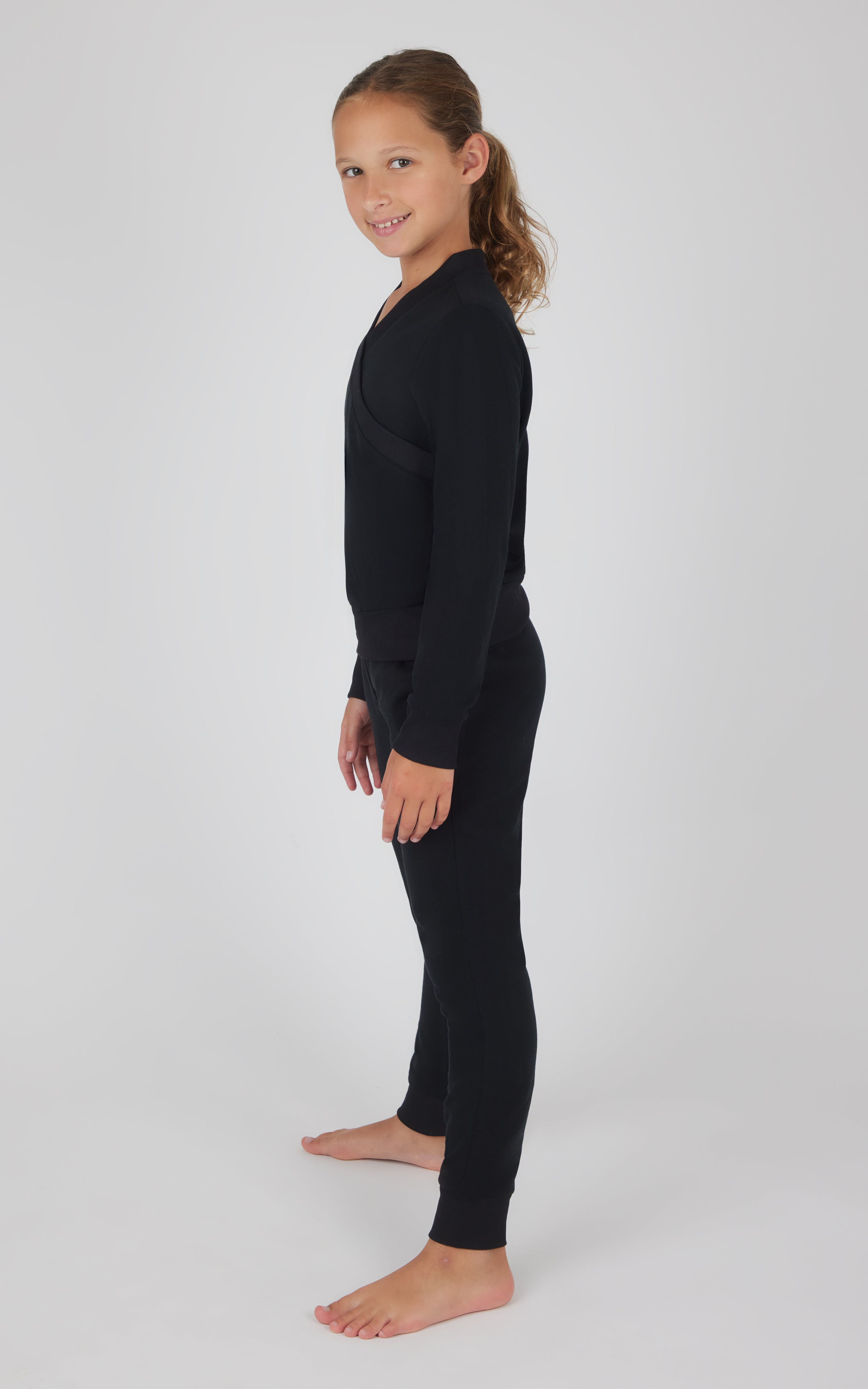 Black girls' 2-piece terry crossover long sleeve top and brushed joggers set, side view.