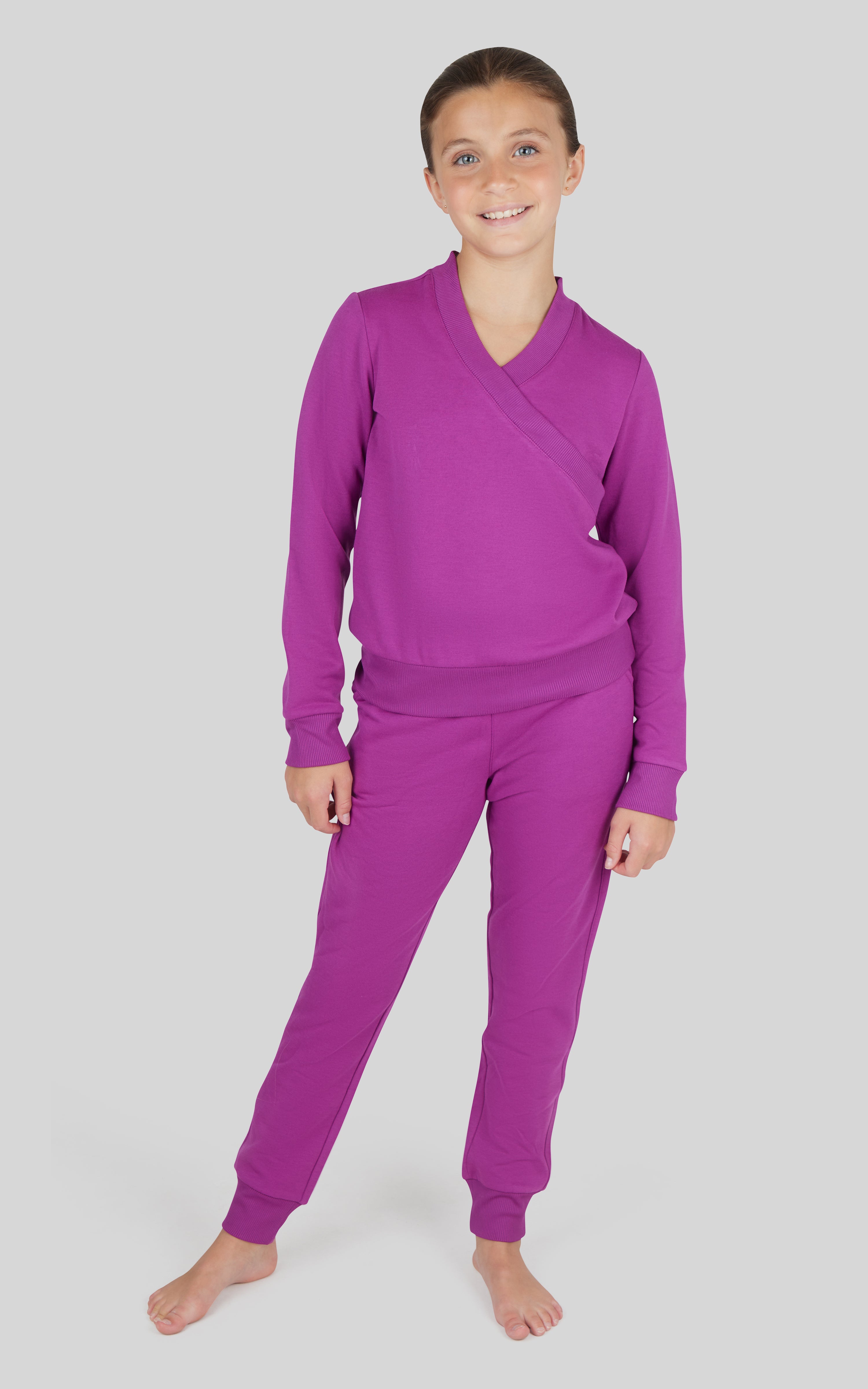 Girls purple terry crossover long sleeve top with matching brushed jogger pants set.
