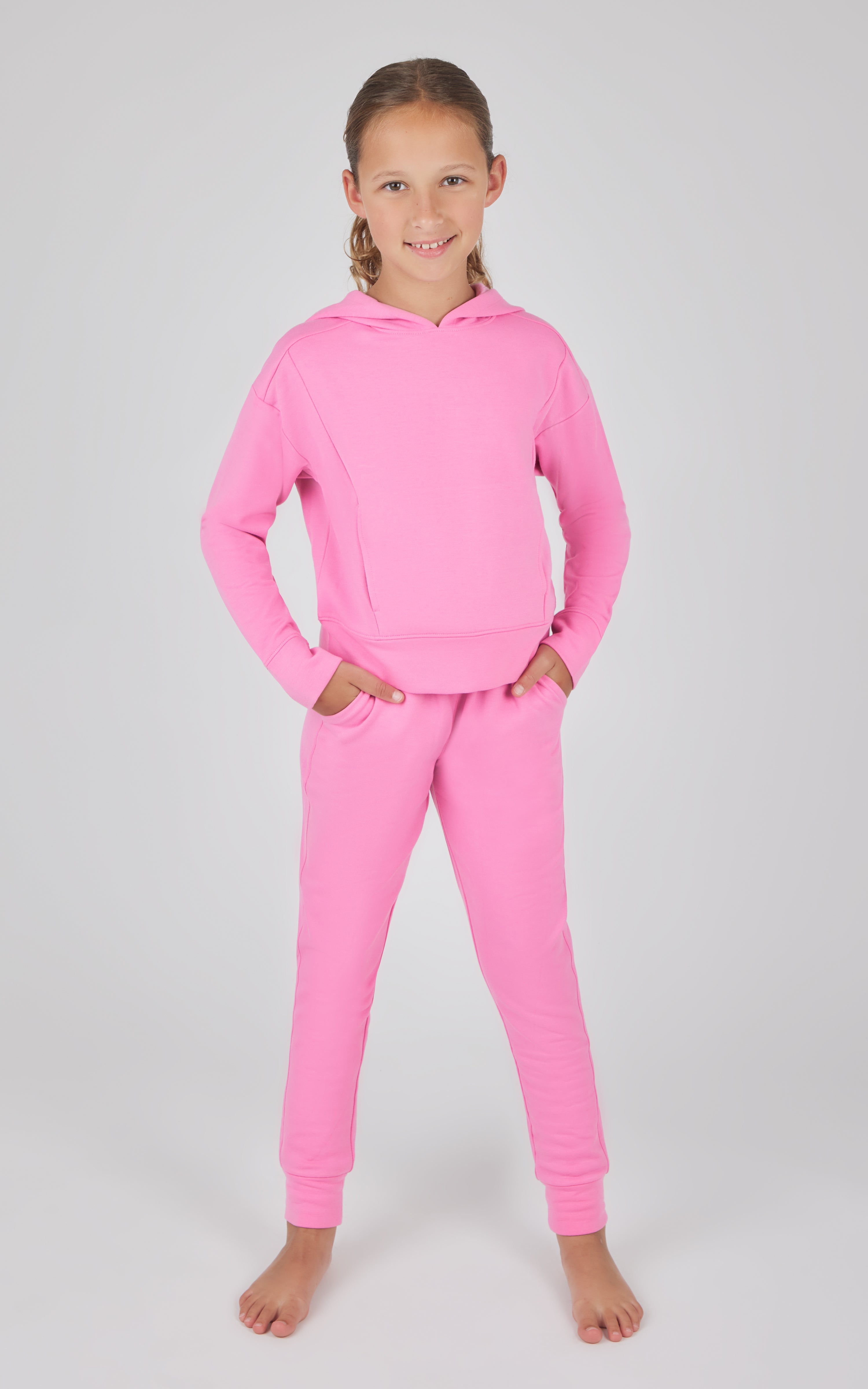 Girls bright pink terry brushed hoodie and jogger set with ribbed cuffs and hem.