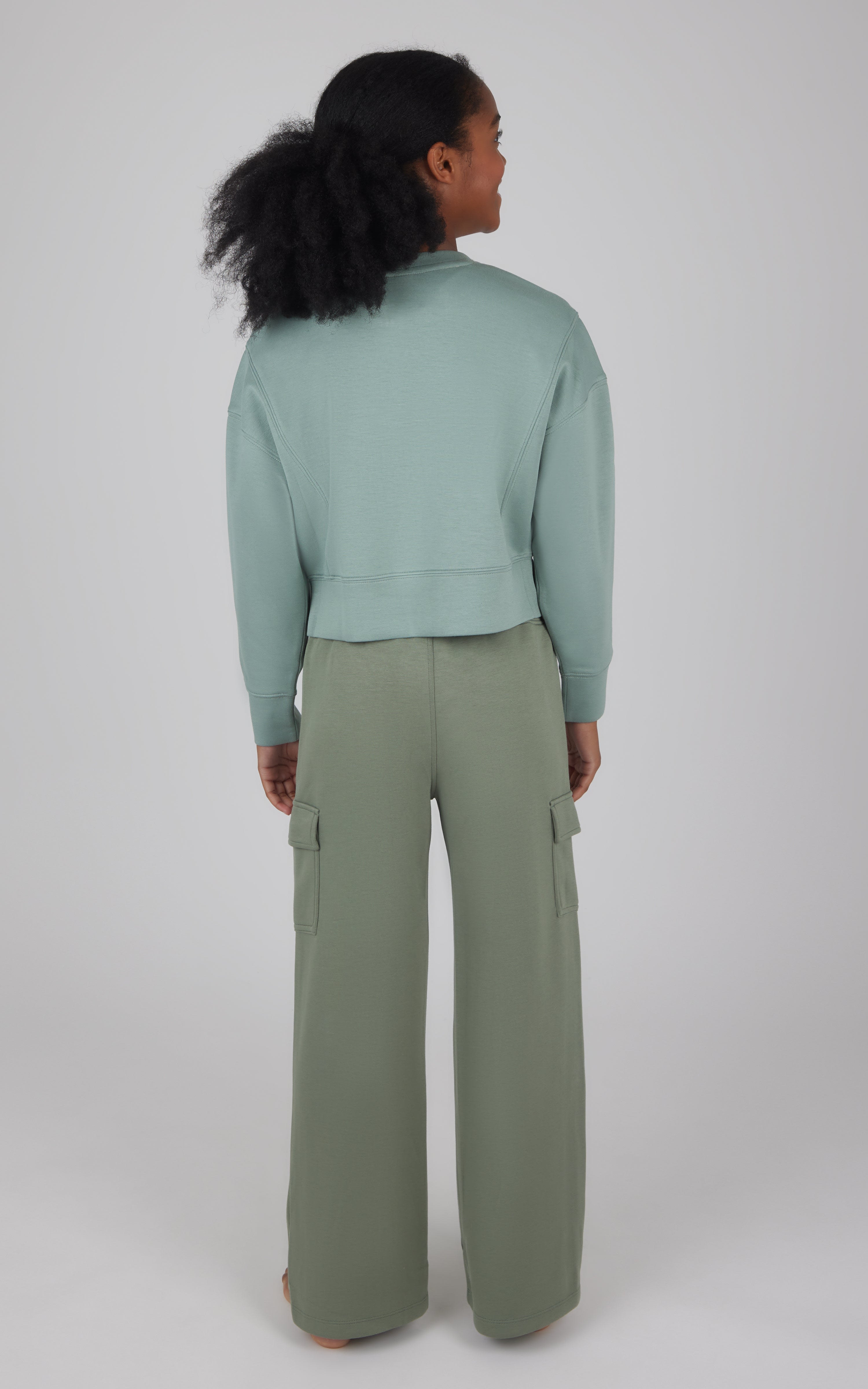 Girls cropped pullover in soft chinoiserie green with wide-leg cargo pants in matching agave green.