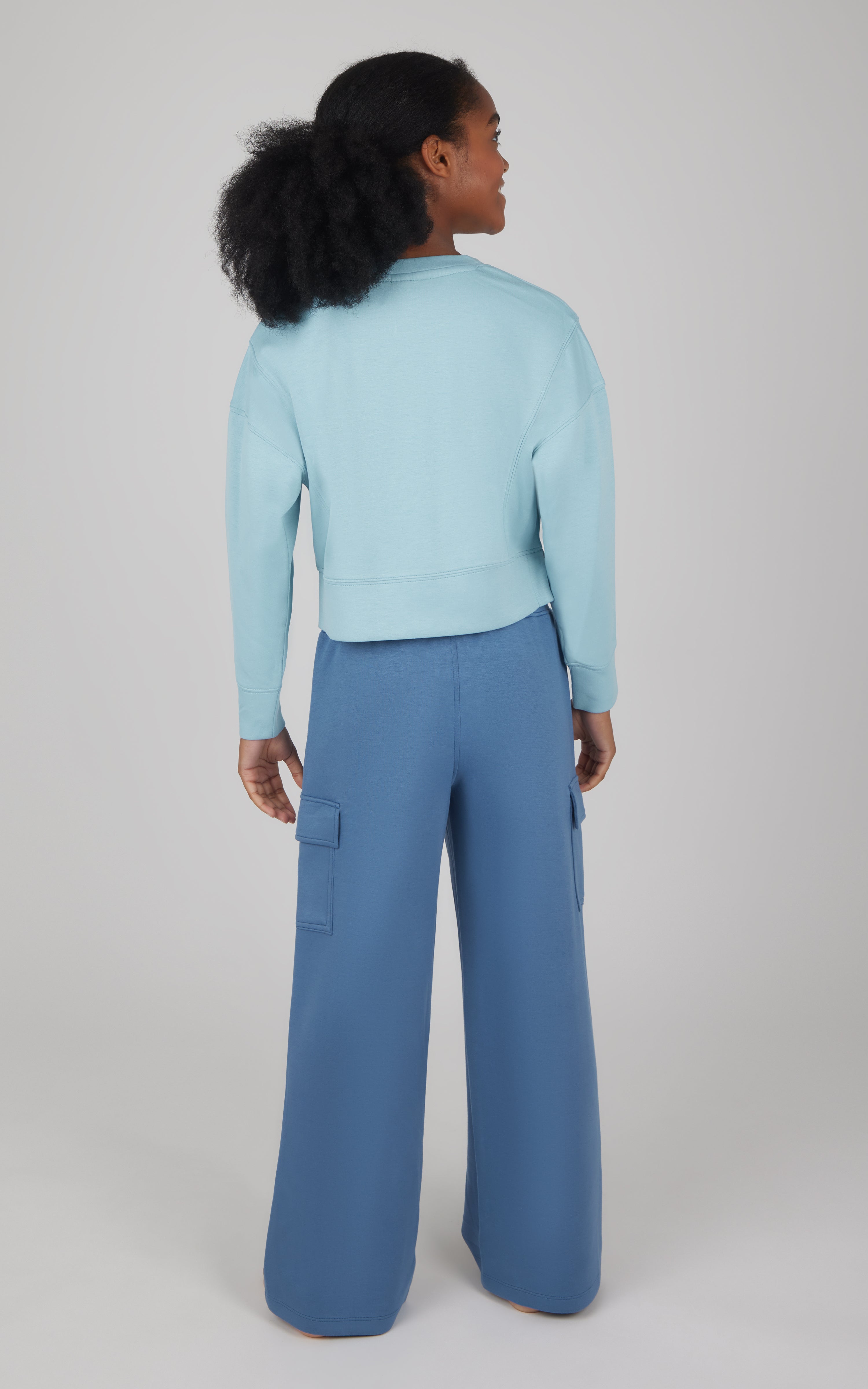 Girls softlite cropped pullover in light blue with matching wide-leg cargo pants in blue.
