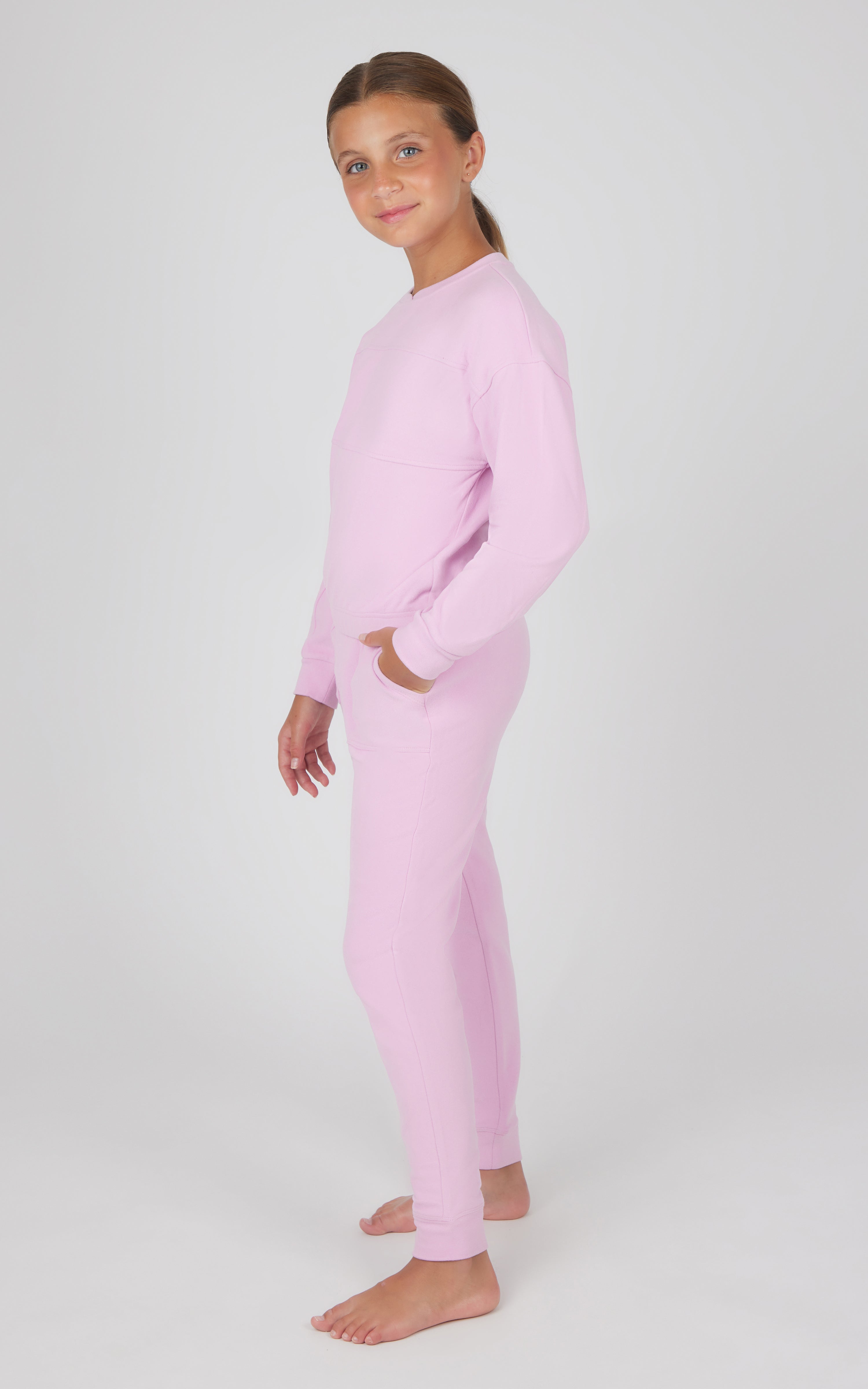 Girls' fuchsia pink melange long sleeve top and jogger set with relaxed fit and ribbed cuffs.