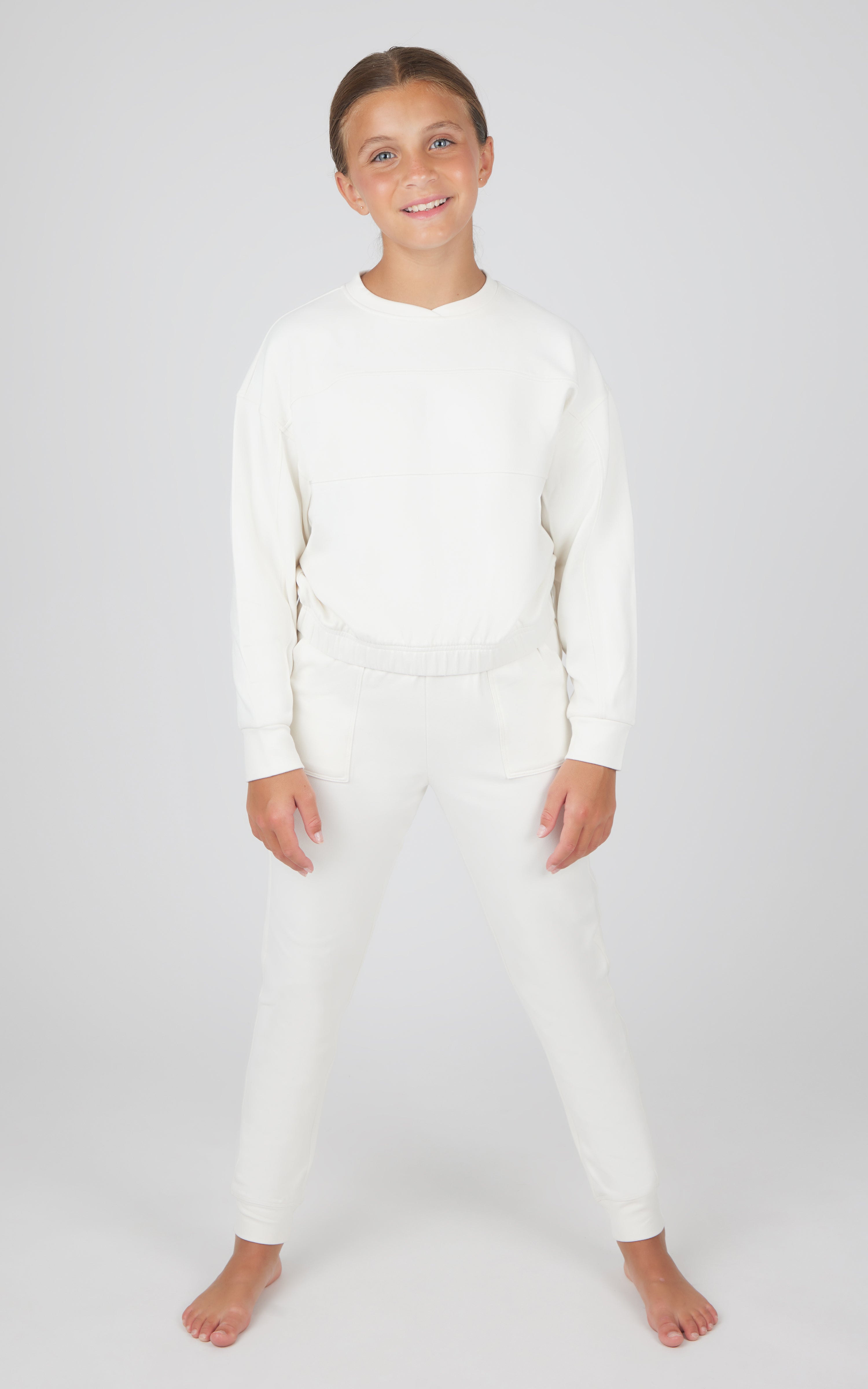 Girls white melange long sleeve top and jogger set with ribbed cuffs and waistband.