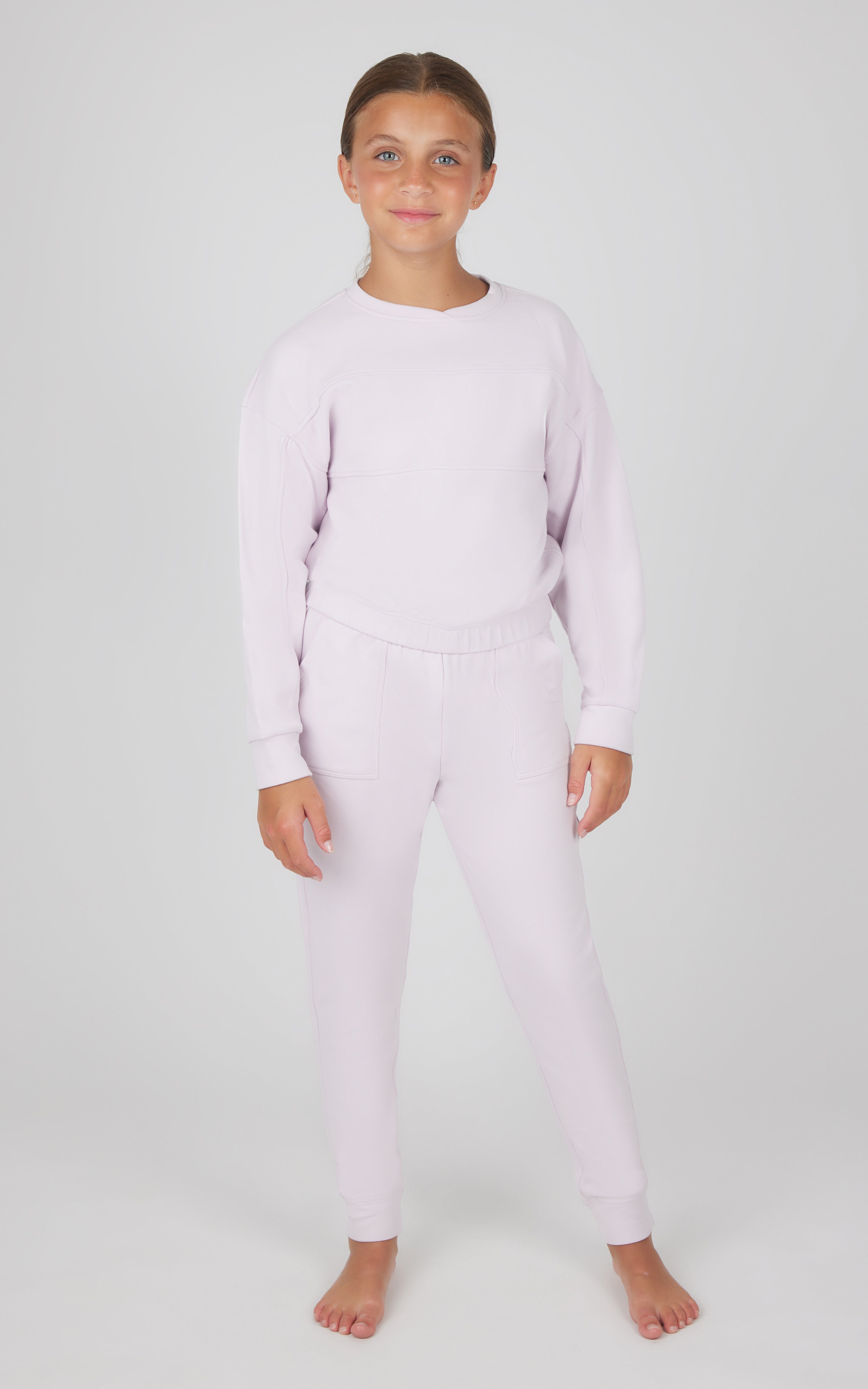 Girls light pink melange long sleeve top and matching jogger pants set.