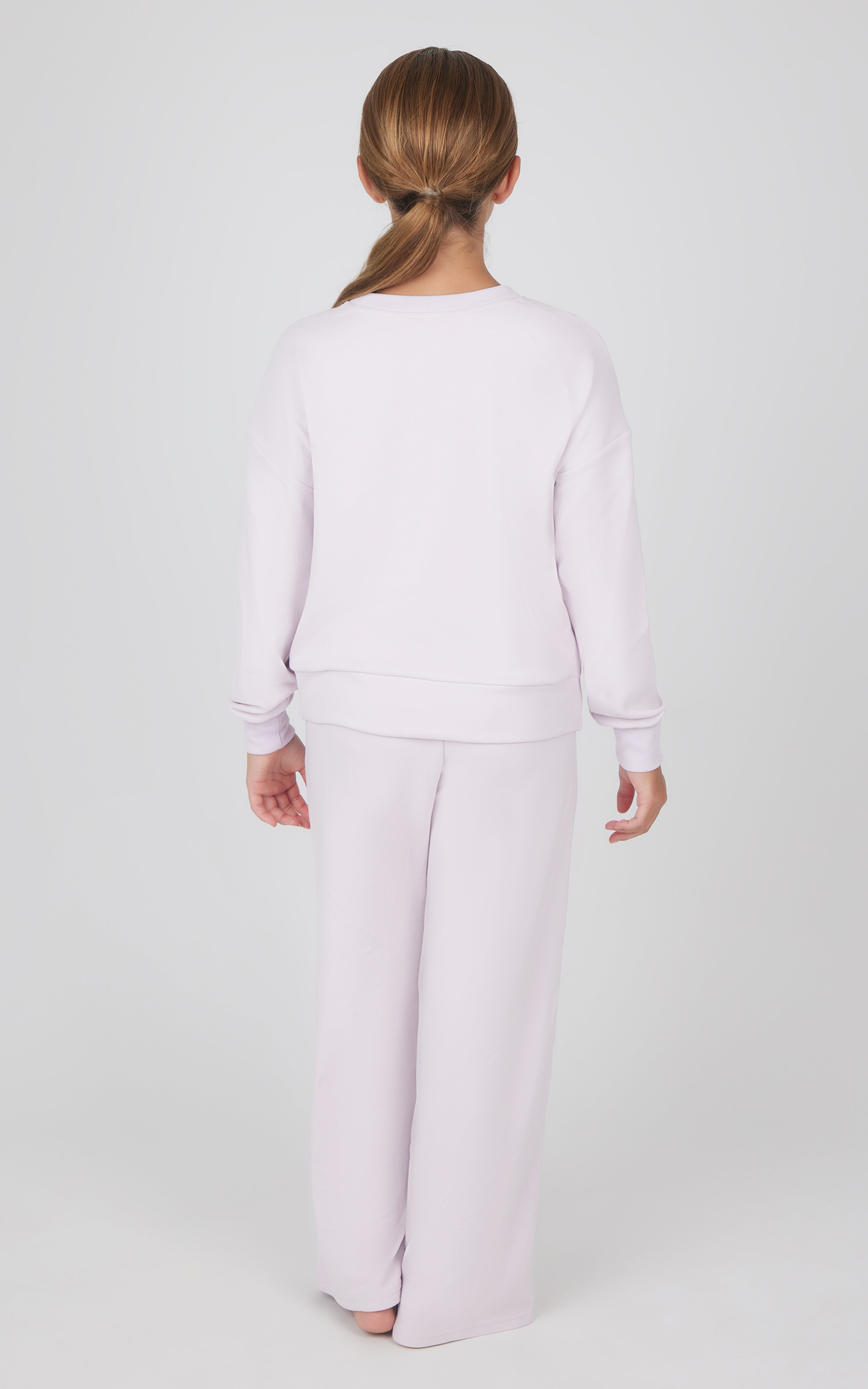 Girls light pink melange sweatshirt and wide leg pants set, shown from back.