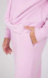 Light pink melange sweatshirt and wide leg pants set with side pocket detail on pants.