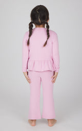 Toddler girls' pink melange pullover with peplum hem and matching flare leg pants, back view.