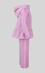 Fuchsia pink girls pullover with peplum hem, matching wide-leg pants, and hooded long sleeves.