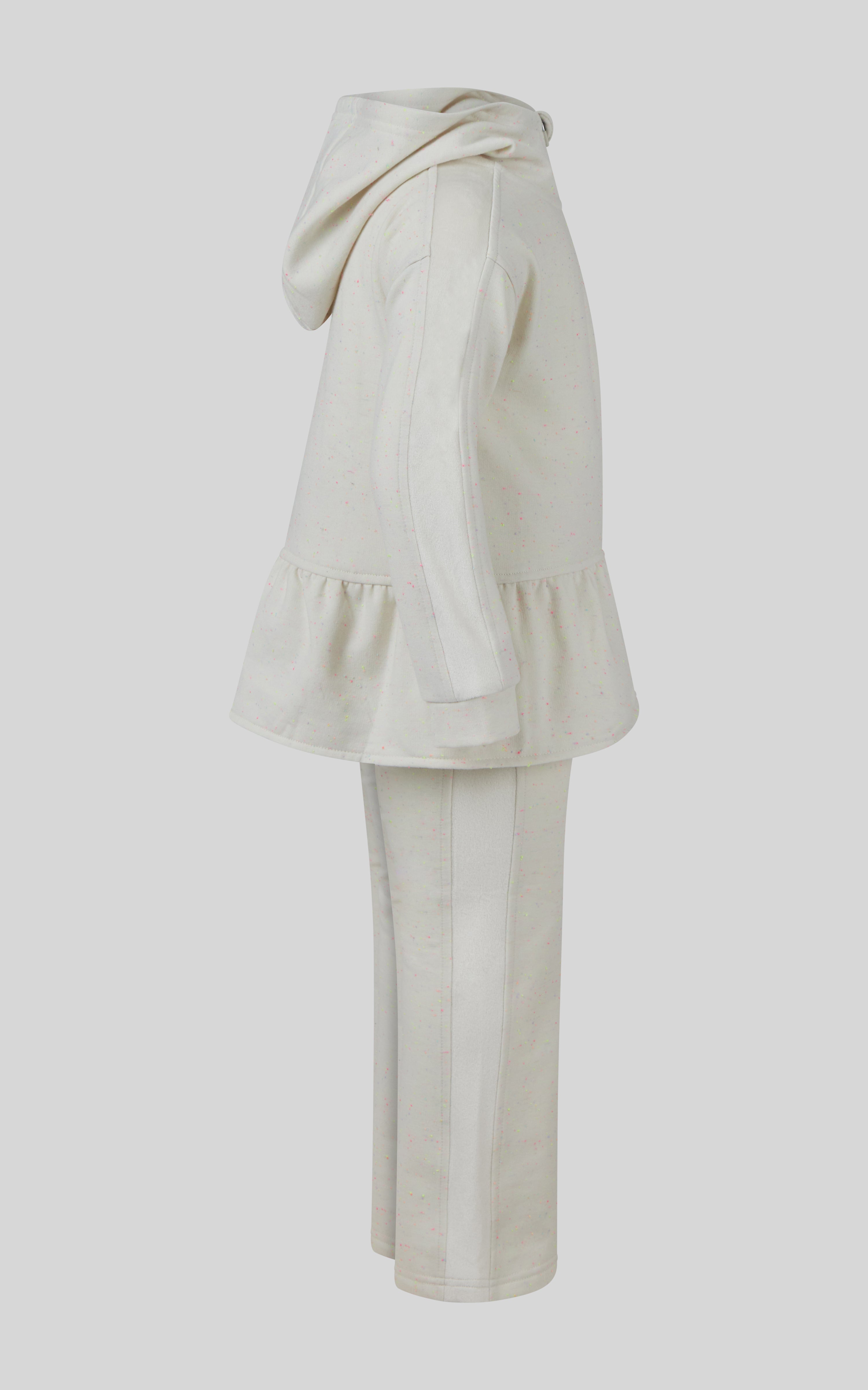 Cream-colored girls 3-piece set with confetti half-zip pullover featuring a ruffled hem, matching flared pants, and a coin.