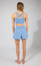 Bubble Blue strappy back bra tank with matching high-waisted running shorts.