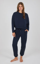Navy-blue relaxed fit sweatshirt and jogger pants with elastic cuffs and drawstring waist.