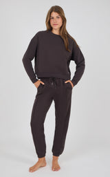 Dark coco cozy long-sleeve pullover and matching pintuck jogger pants set on model.
